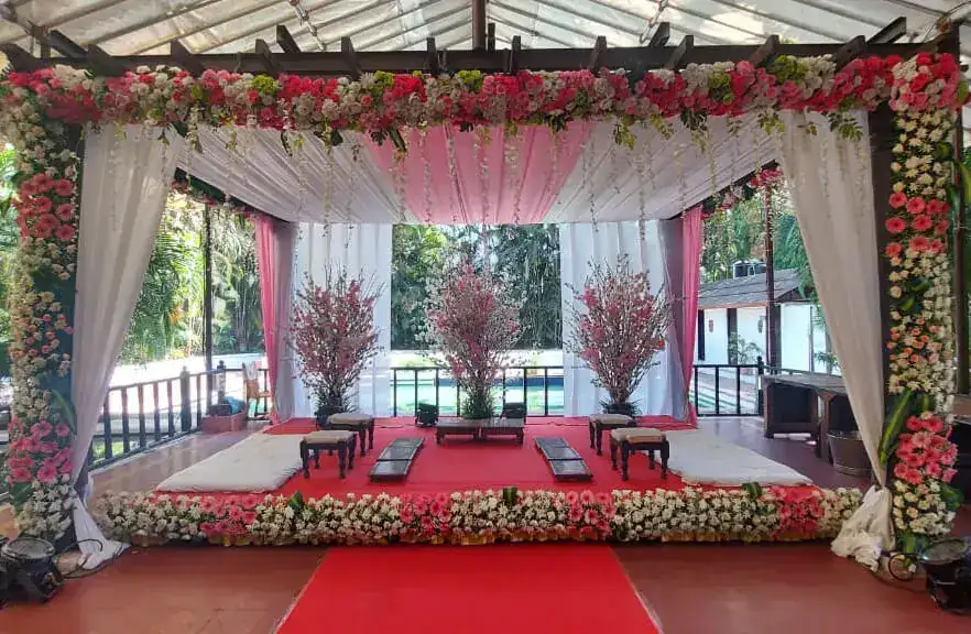 Wedding pavilion mandap decorated with pink and white flowers at Exotica