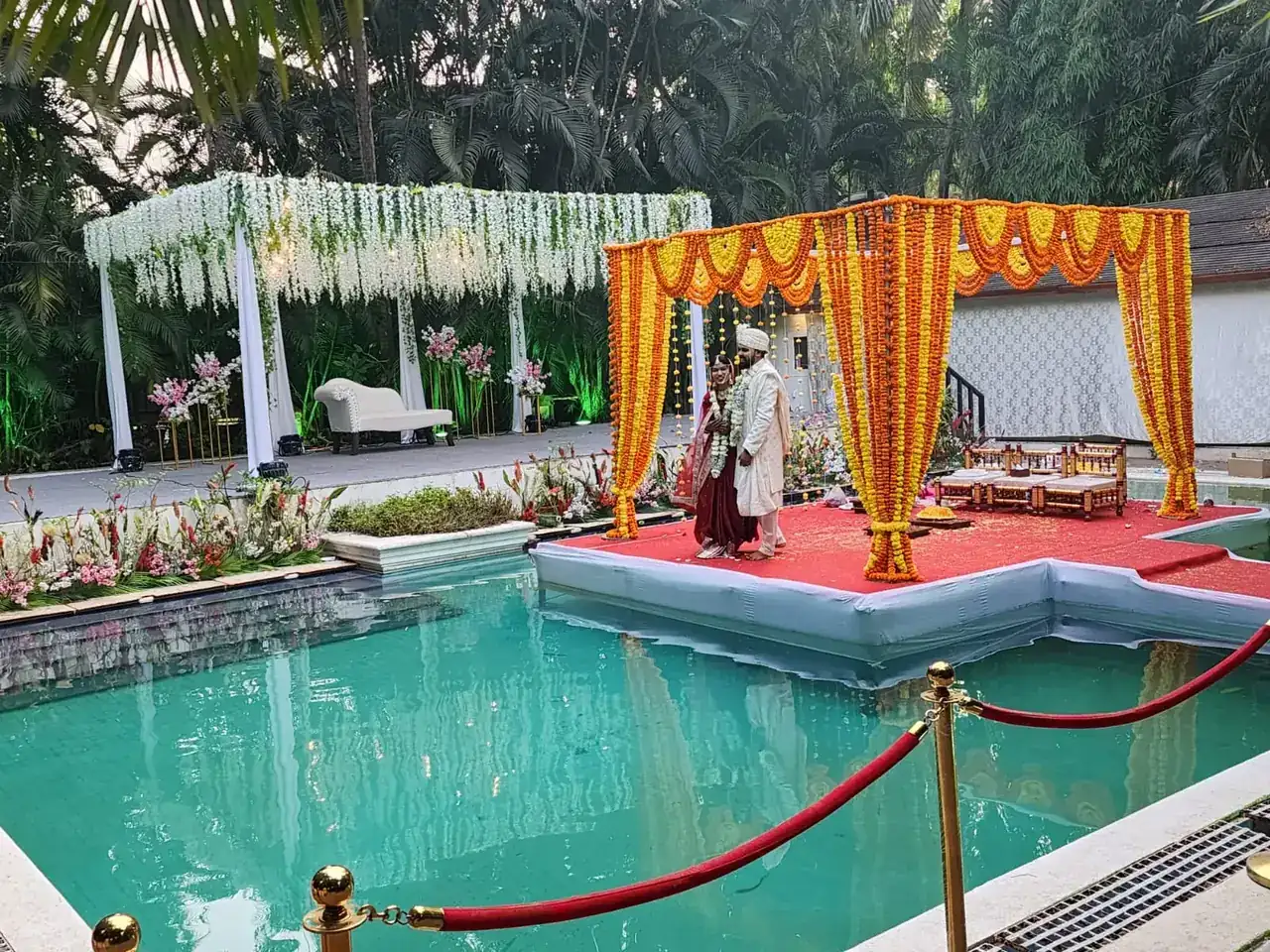 Bride and groom exchanging vows on the floating mandap at Exotica Tropical Retreat
