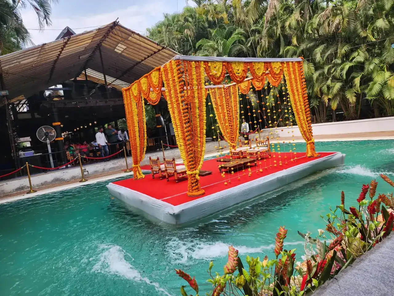 Floating mandap and poolside seen from the gardens at Exotica