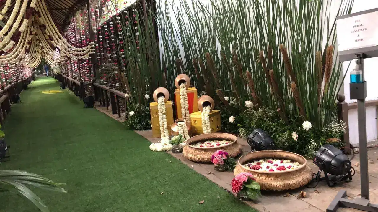 Lawn walkway with welcome floral arrangements at Exotica