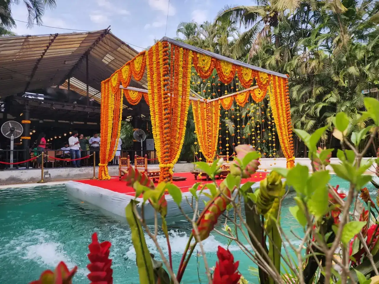Marigold-draped mandap by day at Exotica Tropical Retreat