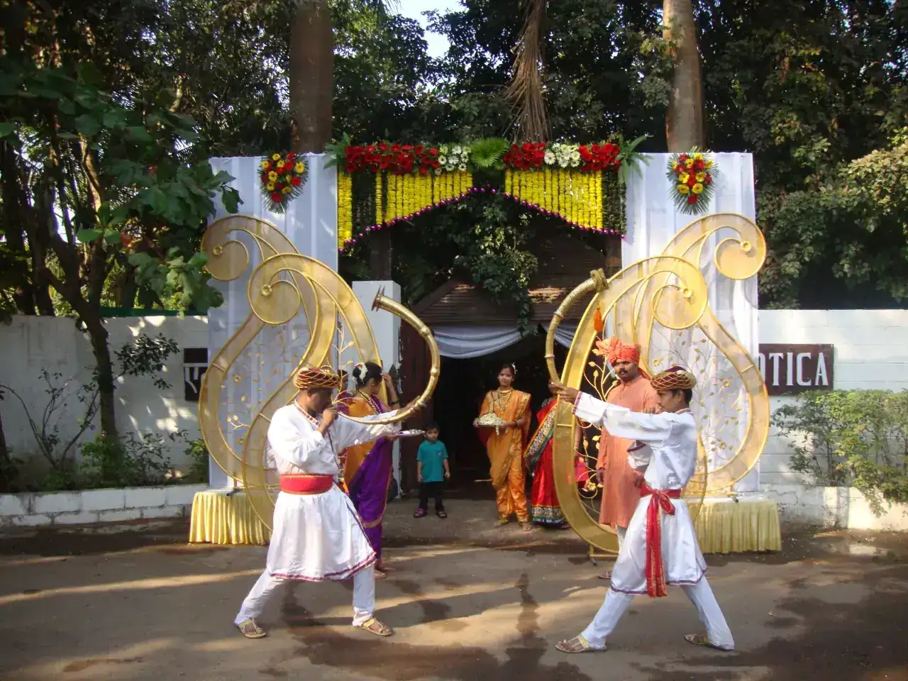 Traditional performers welcoming guests at the Exotica entrance gate